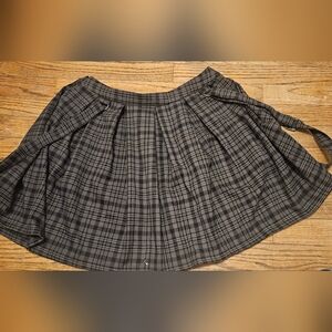 Pleated plaid skirt with suspenders